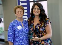 Janice Gray, wife of late Judge Tom Gray, founder presenting Advocate of the Year to Kim Baker