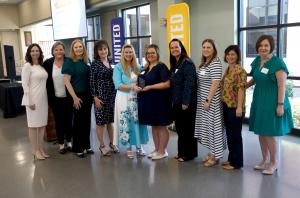 Company of the Year Servpro Headquarters accepting award from Michelle Groves (center)