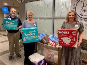 Tory Daughrity (far right) colleting items for Mom & Baby Care Drive