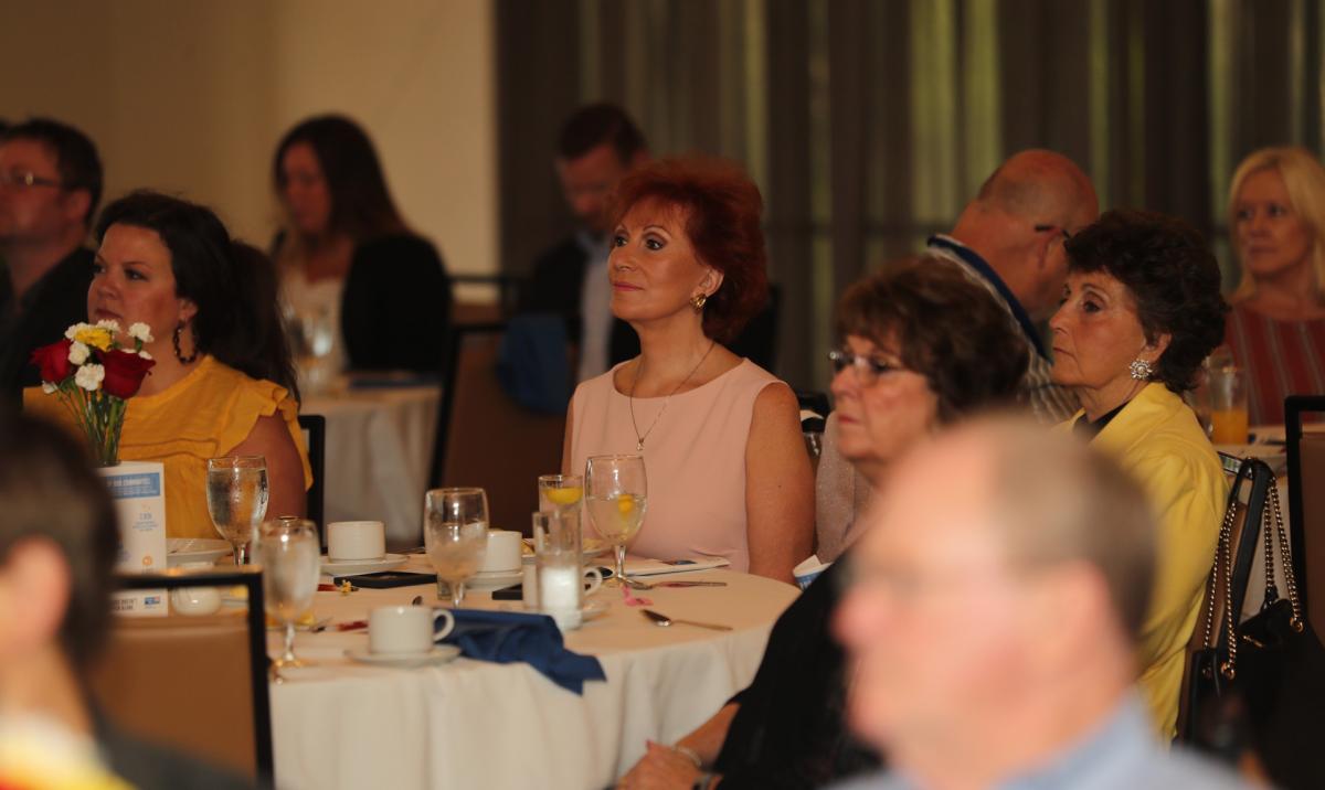 Breakfast guests listen to the comments of United Way Board Chair Lindy Gaughan.