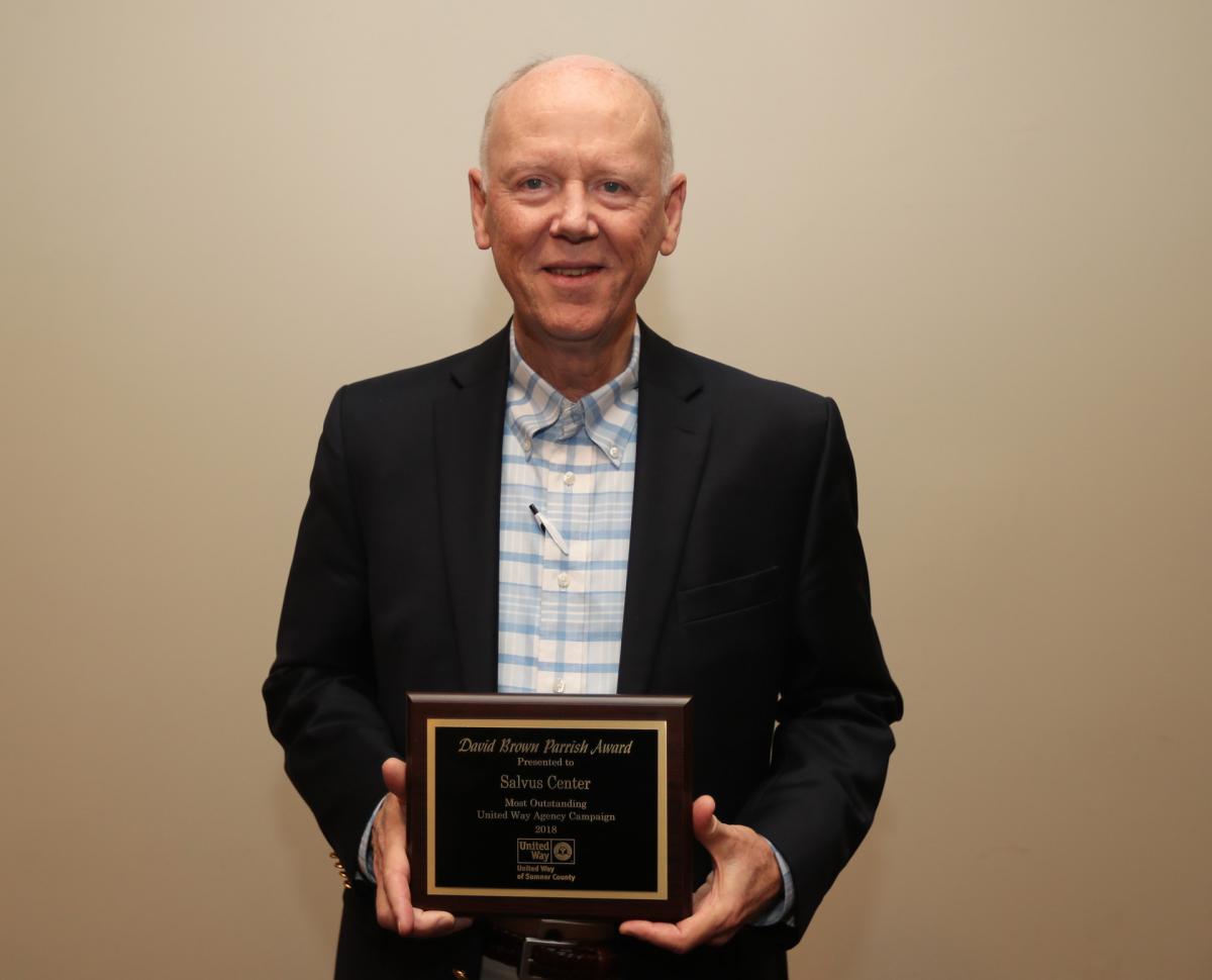 Salvus Center Board Member Ben Duggan accepted the David Brown Parrish Award for best Partner Agency Campaign on behalf of Salvus Center.