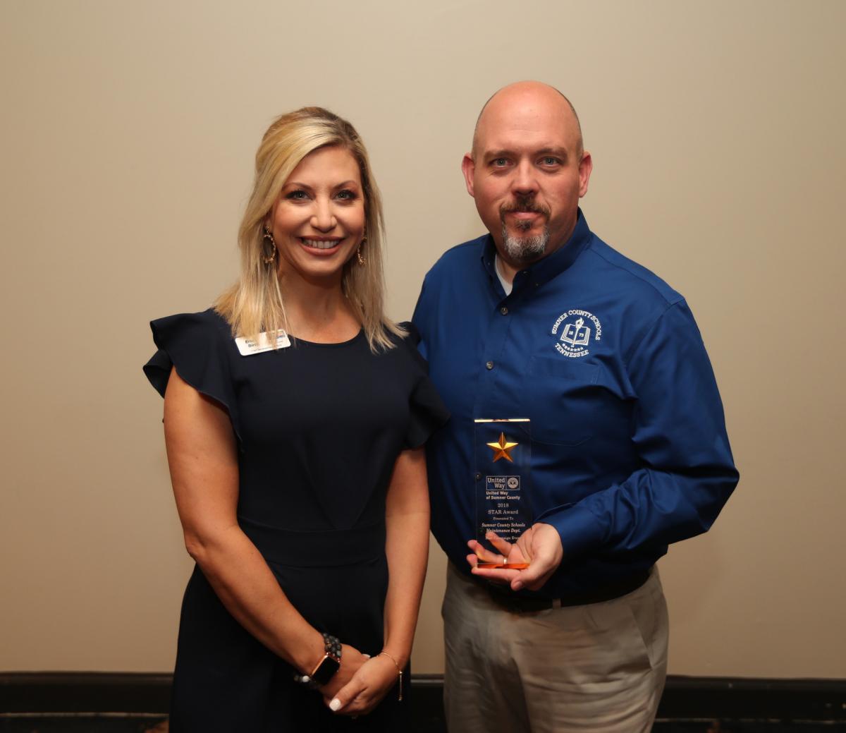UWSC Chief Develpment Officer Erin Birch presents the award for Best Campaign Event to Sumner County Assistant Director of Schools for Facilities and Support Services Andy Brown for the Maintenance Deptartment's Vendor Fair, which raised more than $19,000 for United Way.