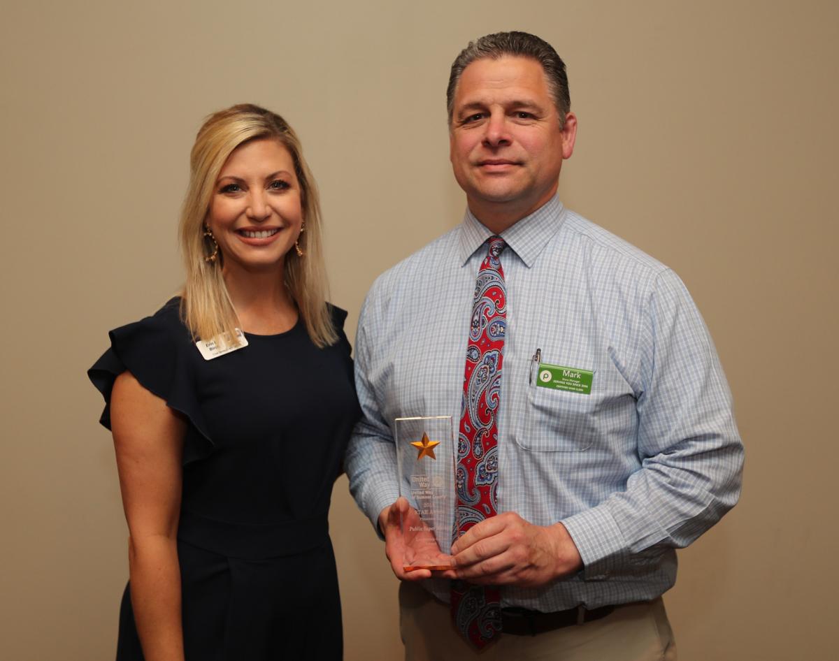 UWSC Chief Development Officer Erin Birch presents the Leadership Givers Award to Mark Charest of Publix Supermarkets. Two-hundred-and-forty-six associates from Publix stores in Gallatin, Goodlettsville, and Hendersonville donated $74,000 to the 2018 United Way campaign, of which $41,756 was given by 43 leadership donors with gifts in excess of $500.