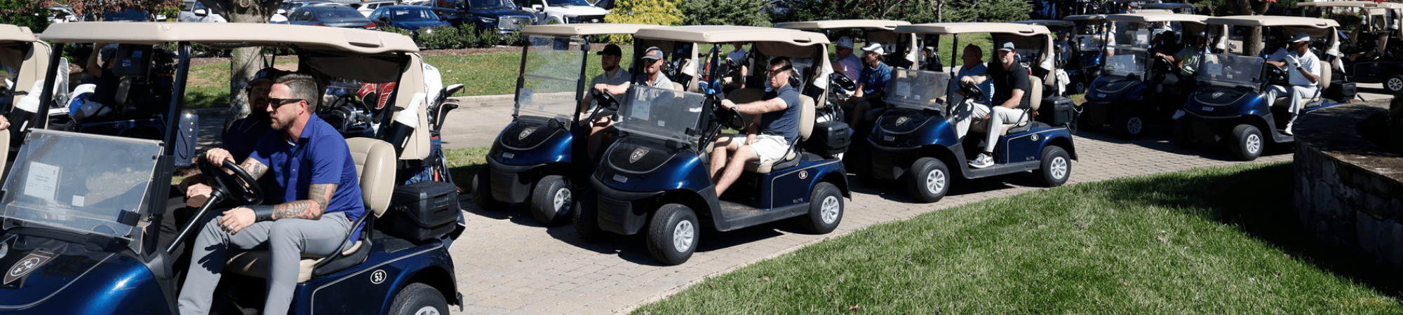 golf carts heading out for 2024 UWSC Fall Classic Golf Scramble