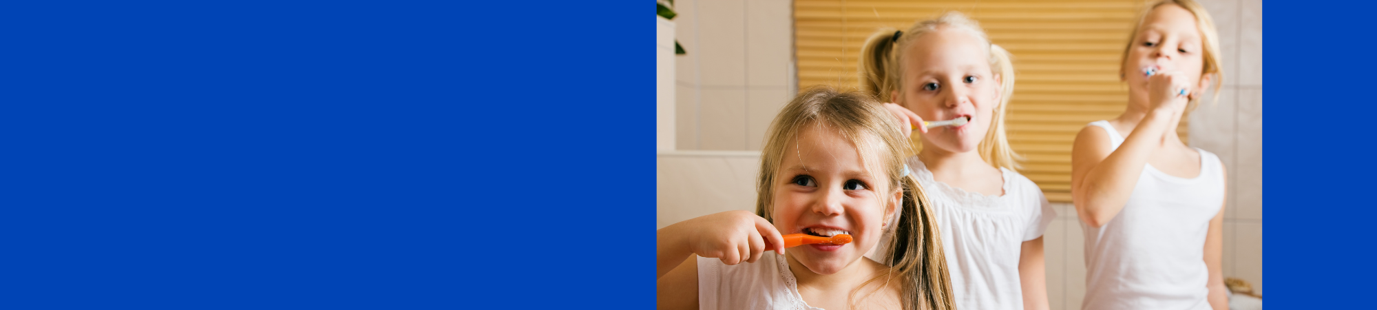 3 kids brushing teeth