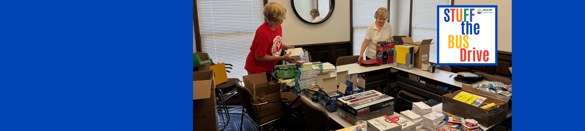 volunteers sorting school supplies