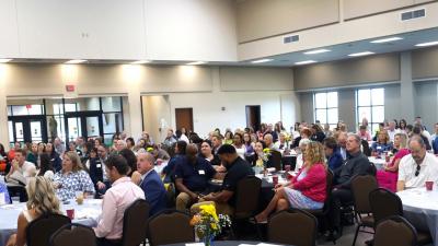 Crowd seated at 2024 UWSC Community Impact Breakfast