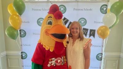 Lynn Johnson with school mascot