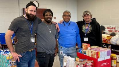 UWSC Volunteers with Douglas Fuqua Sr. pictured in blue